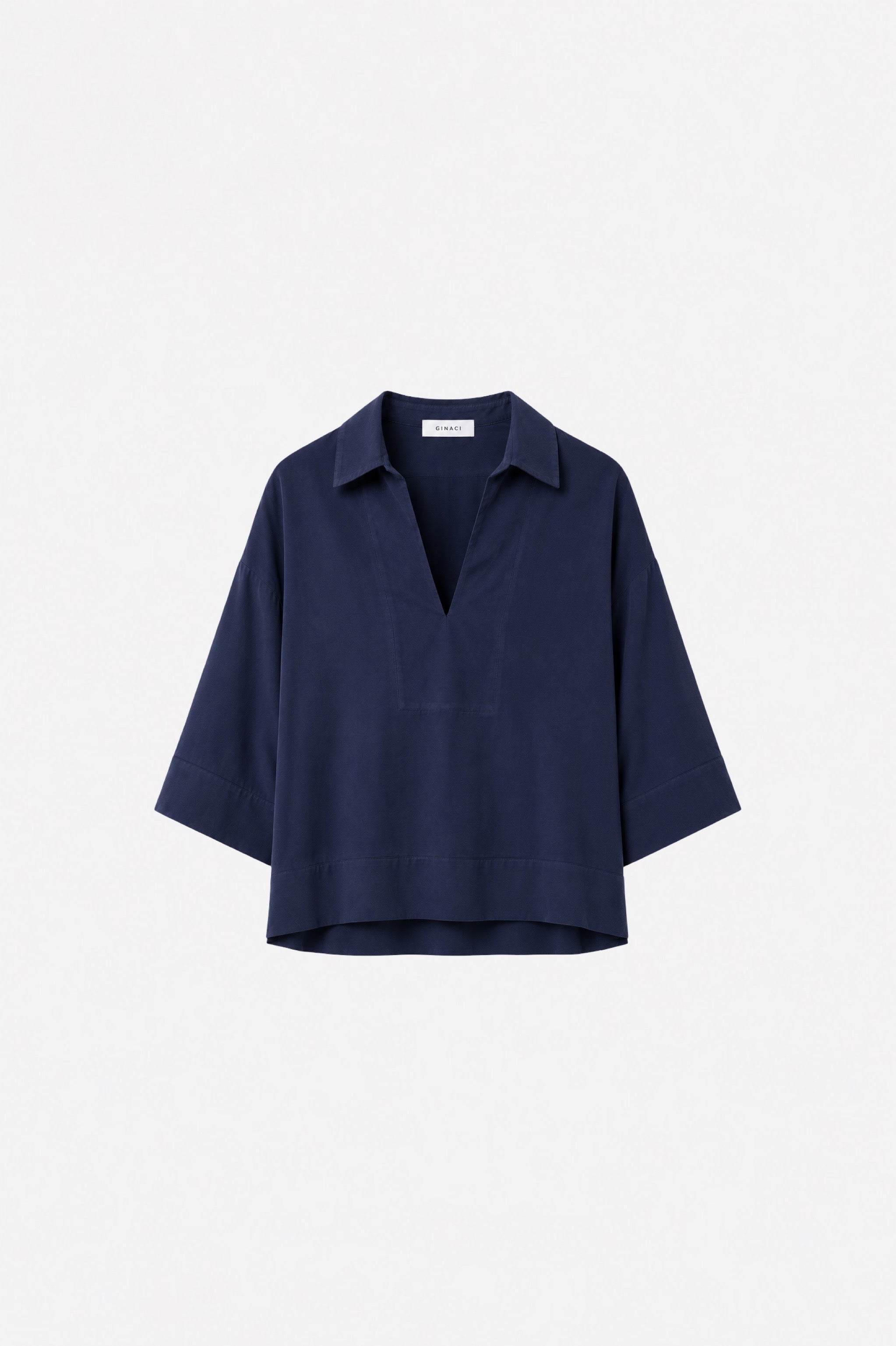 Lacivert Tencel rahat kesim üst by Ginaci Türkiye, lightweight and soft fabric, casual style, displayed on a hanger.