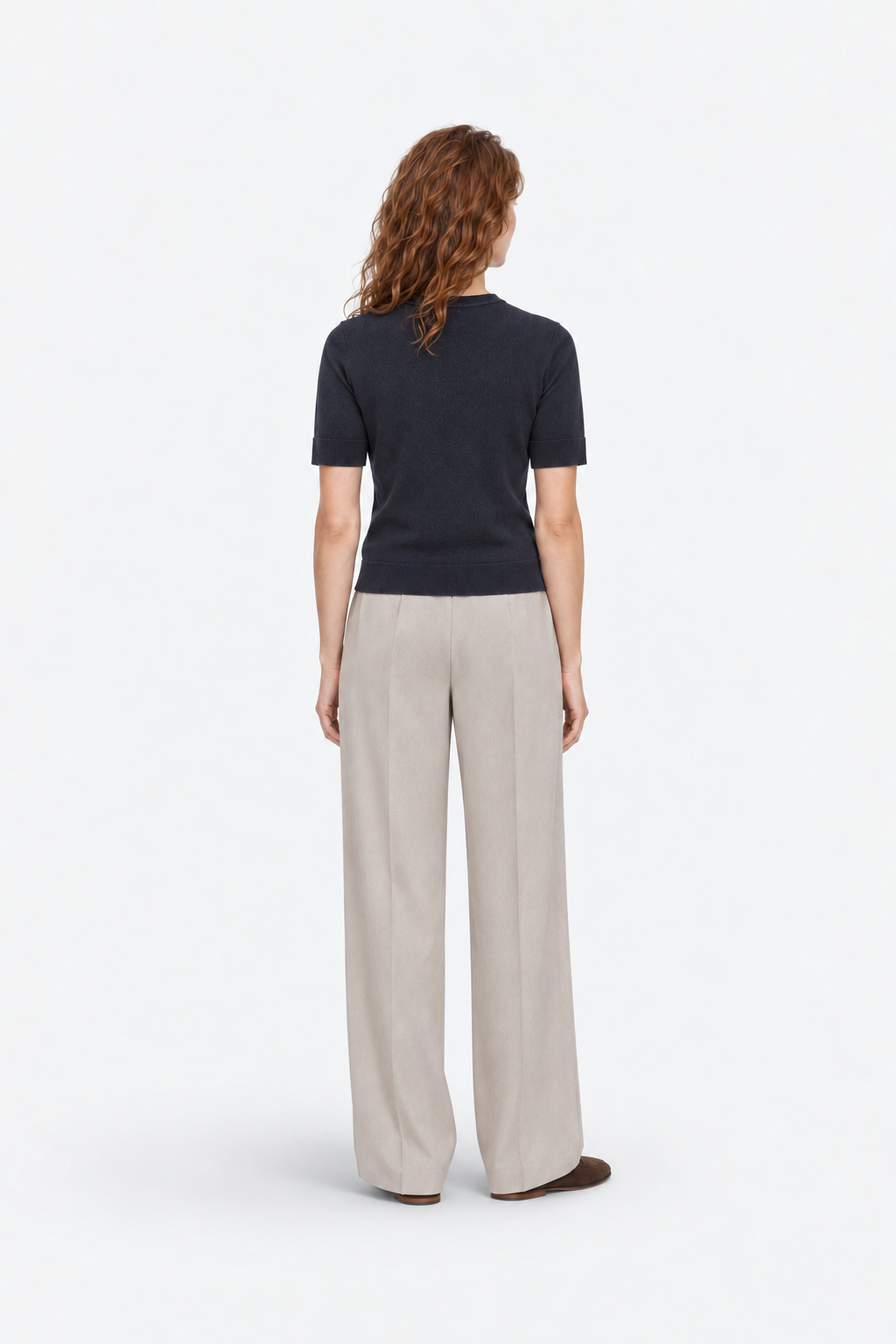 Navy blue polo shirt with round neckline from Ginaci Türkiye, displayed from the back view, made of soft knit fabric.
