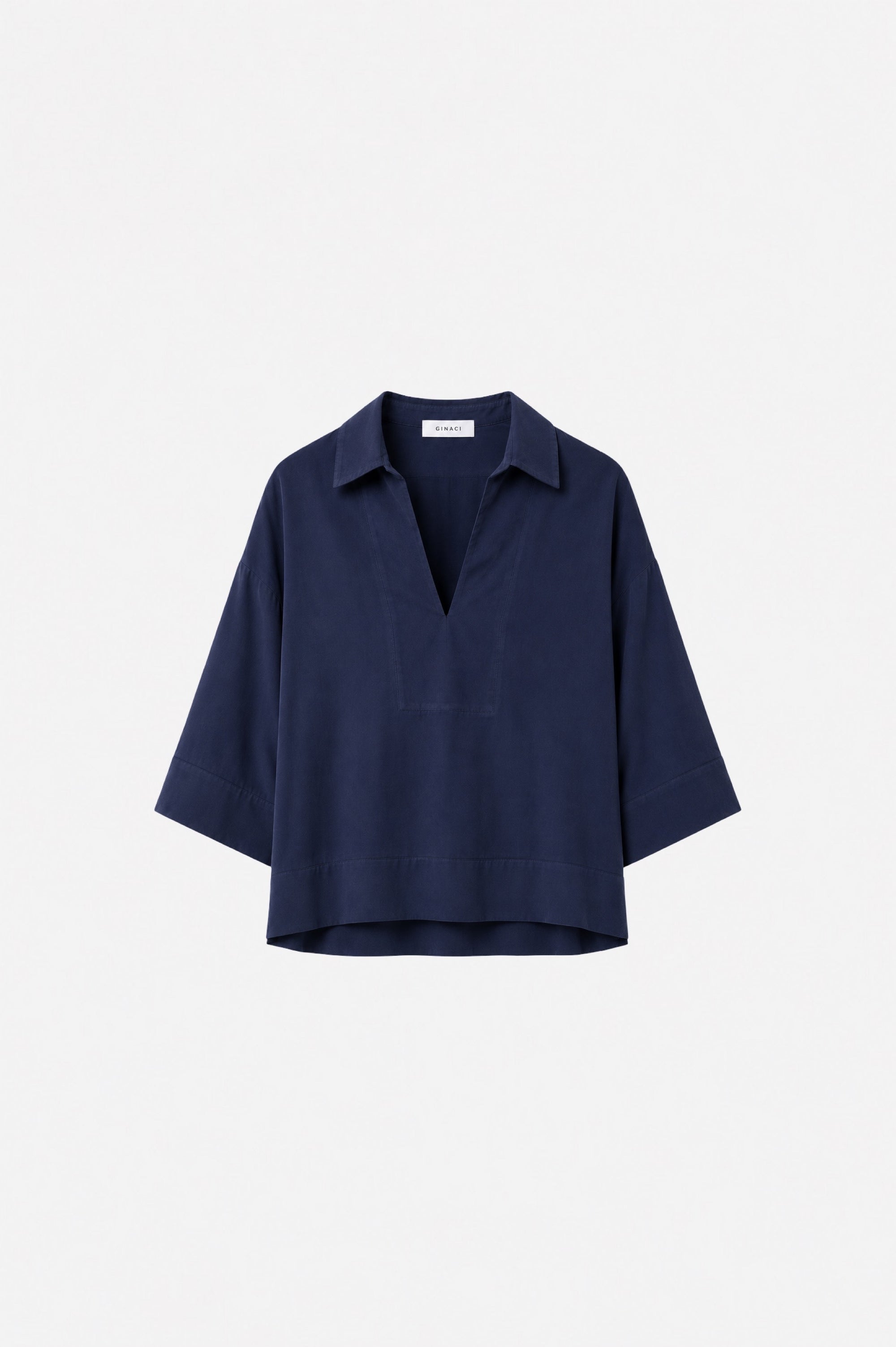 Lacivert Tencel rahat kesim üst by Ginaci Türkiye, lightweight and soft fabric, casual style, displayed on a hanger.