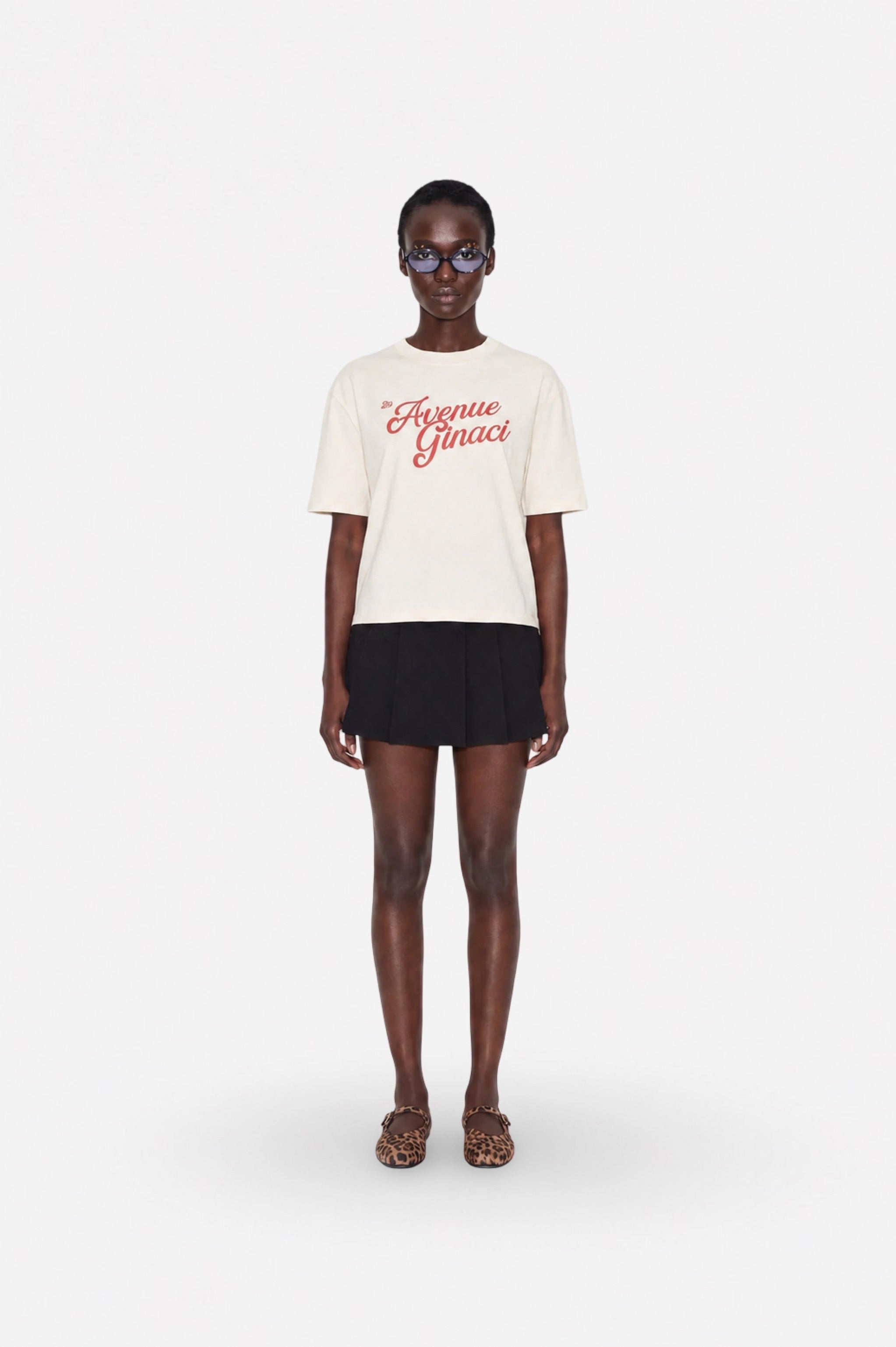 Oversized cream cotton T-shirt by Ginaci Türkiye, casual fit, soft fabric, relaxed style, displayed on a hanger.