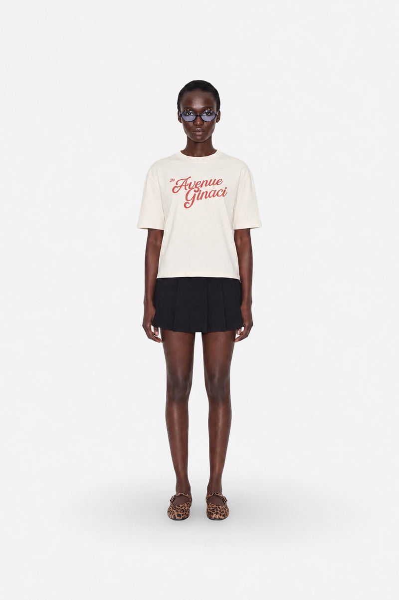 Oversized cream cotton T-shirt by Ginaci Türkiye, casual fit, soft fabric, relaxed style, displayed on a hanger.