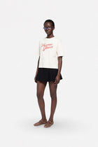 Light beige oversized cotton T-shirt from Ginaci Türkiye, featuring a relaxed fit and soft fabric for comfortable wear.