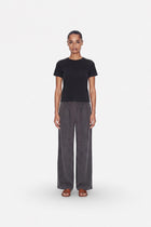 Gray Tencel fabric wide-leg pants with pleats from Ginaci Türkiye, featuring a relaxed fit and comfortable design.