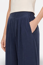 Lacivert Tencel Kumaş bol paça piliseli pantolon from Ginaci Türkiye, featuring wide legs and stylish design.