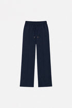 Navy blue Ginaci sweatpants with detailed stitching, showing the relaxed fit and elastic waistband for comfortable casual wear.