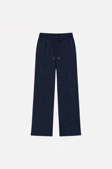Navy blue Ginaci sweatpants with detailed stitching, showing the relaxed fit and elastic waistband for comfortable casual wear.