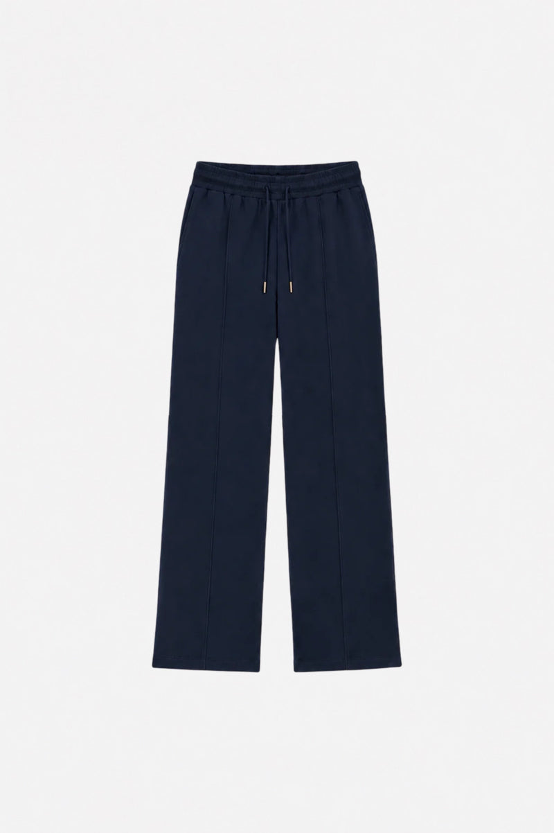 Navy blue Ginaci sweatpants with detailed stitching, showing the relaxed fit and elastic waistband for comfortable casual wear.