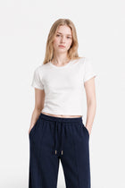 Navy blue stitched detail sweatpants from Ginaci, showing the fabric texture and relaxed fit.