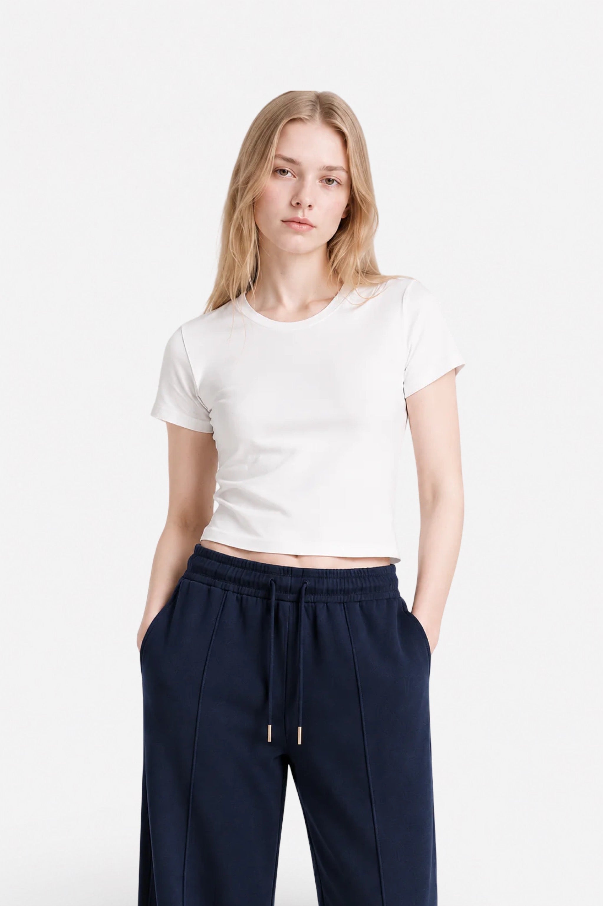 Navy blue stitched detail sweatpants from Ginaci, showing the fabric texture and relaxed fit.