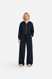 Navy blue zip-up hoodie from Ginaci with a hood and slim fit, made of lightweight, comfortable fabric for casual wear.