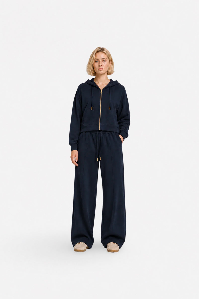 Navy blue zip-up hoodie from Ginaci with a hood and slim fit, made of lightweight, comfortable fabric for casual wear.