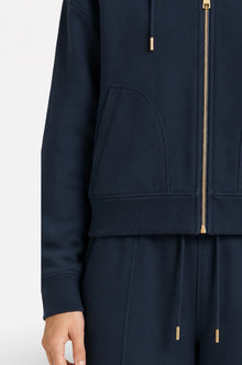 Navy blue Ginaci zip-up hoodie with a hood and slim fit, made of lightweight, soft athletic fabric for comfortable casual wear.
