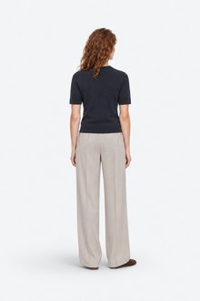 Navy blue polo shirt with round neckline from Ginaci Türkiye, displayed from the back view, made of soft knit fabric.