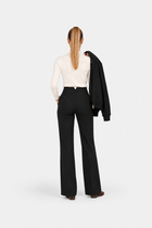 Black high-waisted fit pants from Ginaci, showcasing a sleek sports-chic design with tailored fit and modern style.