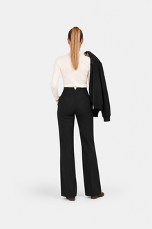 Black high-waisted fit pants from Ginaci, showcasing a sleek sports-chic design with tailored fit and modern style.