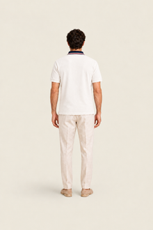 White pike polo shirt by Ginaci Türkiye, shown from the back, featuring classic collar and short sleeves.