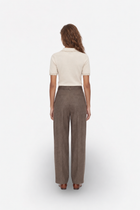 Ecru polo yaka triko sweater by Ginaci Türkiye, shown from the back, featuring a beige knit fabric and classic polo collar.