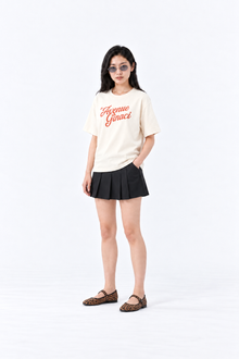 Light beige oversized cotton T-shirt from Ginaci Türkiye, front view showing relaxed fit and soft fabric.