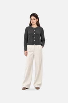 Gray pearl-button knit cardigan from Ginaci Turkey featuring a front view with a cozy, classic design and pearl buttons.