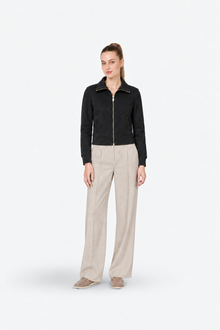 Black zip-up high-neck slim-fit sporty and stylish Ginaci jacket, front view showing sleek design and modern fit.