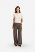 Ecru Polo Yaka Triko by Ginaci Türkiye, front view showing beige knit polo sweater with a classic collar and textured fabric.