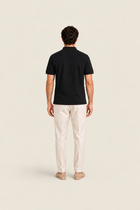 Black Pike Polo shirt from Ginaci Türkiye, shown from the back with a classic collar and smooth fabric.
